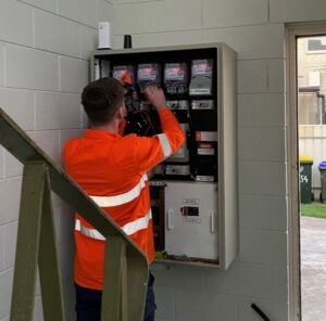Adelaide electrician updating a communal switchboard