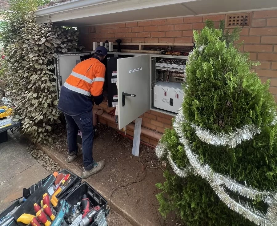 Electrician Inspecting a Switchboard - C & R All Spark Electrical